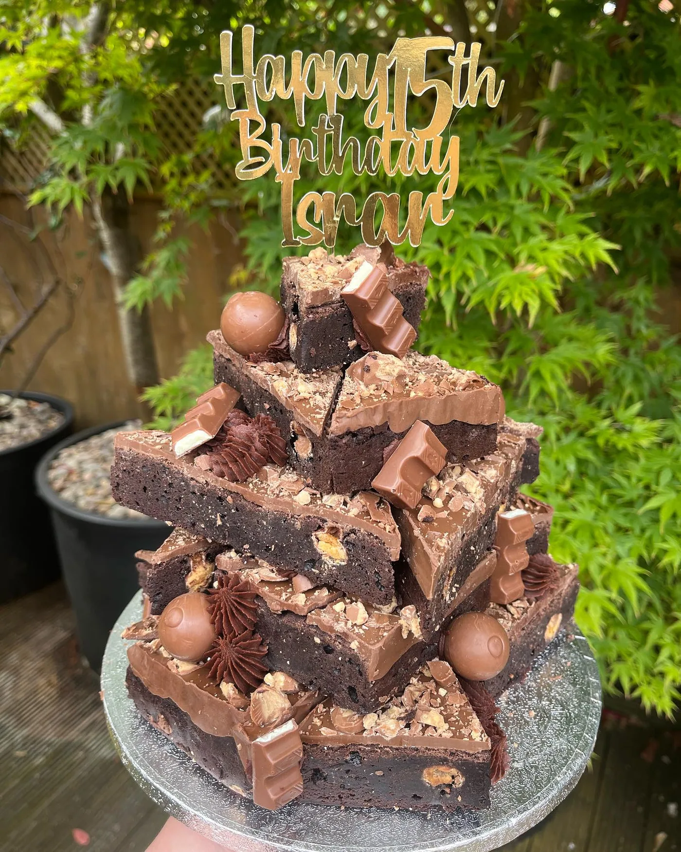 A tall celebration stack made with chocolate brownies